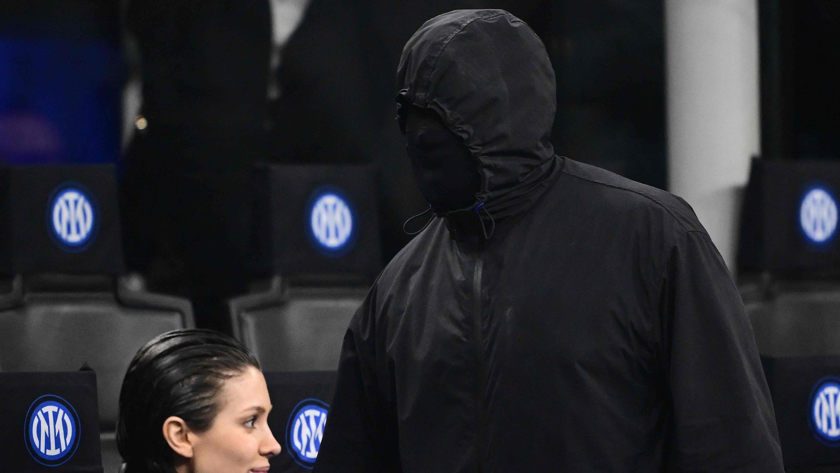Kanye West appears hooded in the stands of the Inter Milan-Atlético Madrid Champions League match